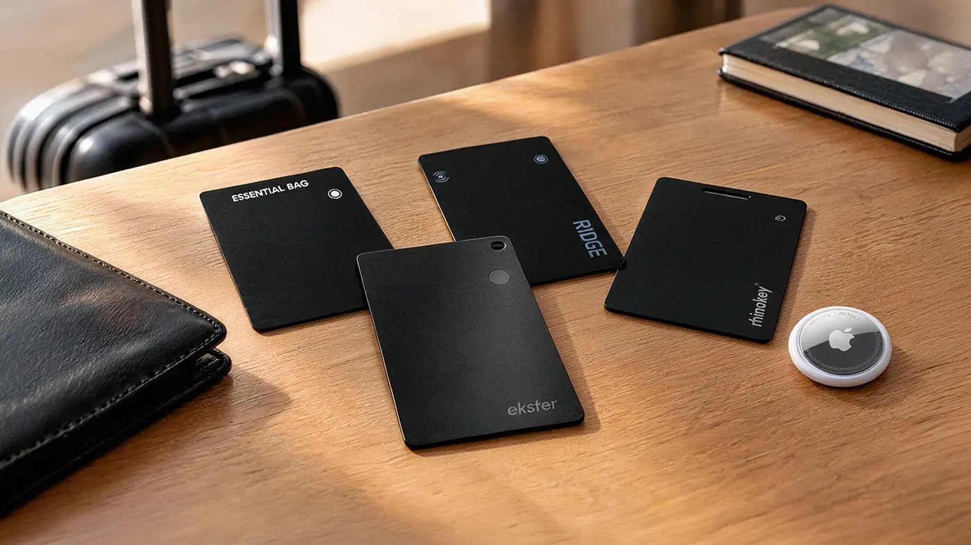 All five tracker cards tested, laid out on a wooden desk